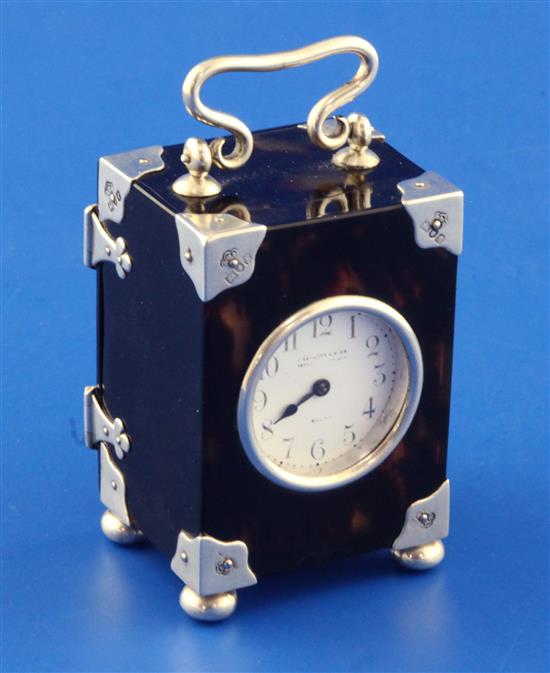 An Edwardian silver mounted tortoiseshell carriage timepiece, 3in.